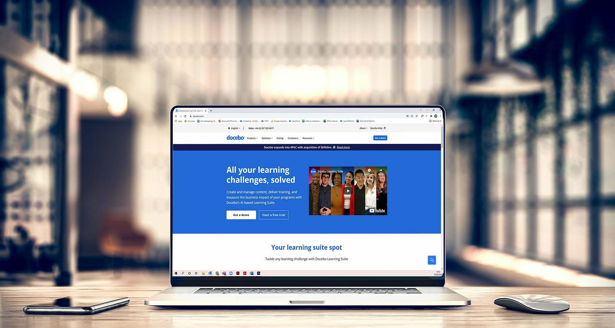 An image of a laptop with the Docebo LMS platform loaded.
