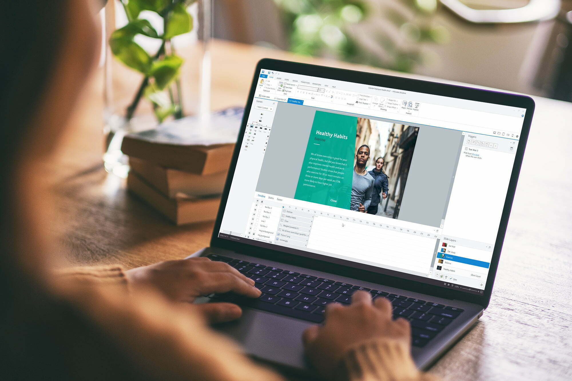 Mockup image of a woman using and typing on laptop with blank white desktop screen on wooden table