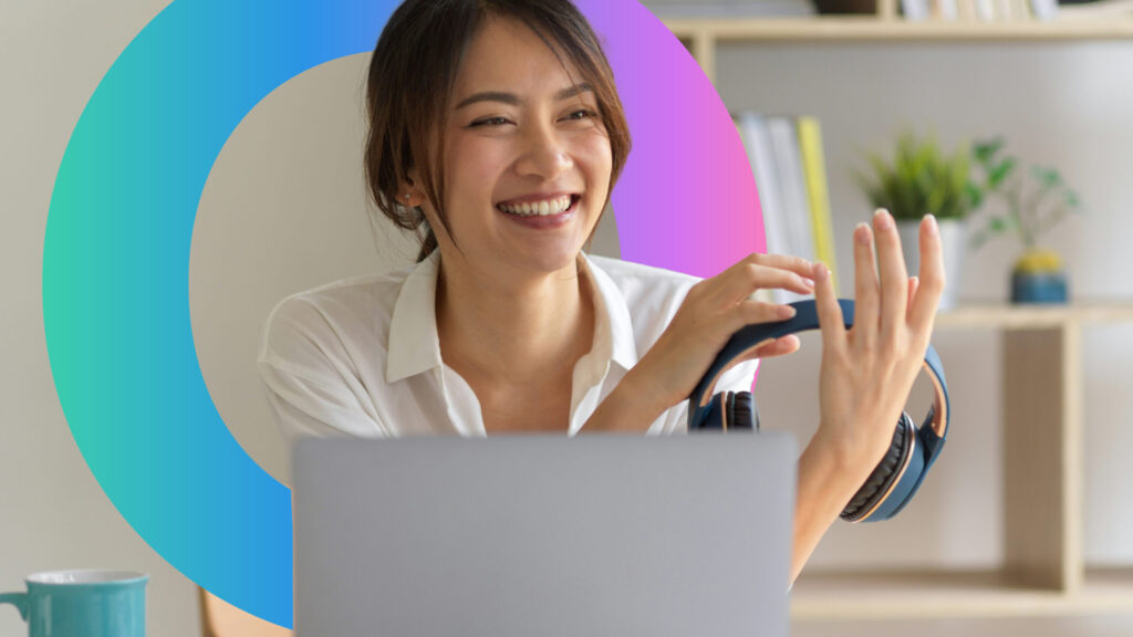 women smiling looking at laptop